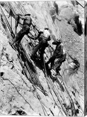 Drillers at work on canyon wall above power plant location
