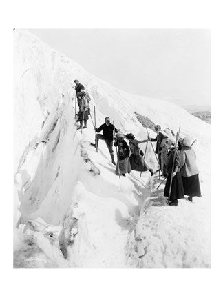 Group of men and women climbing Paradise Glacier in Mt. Rainier National Park, Washington