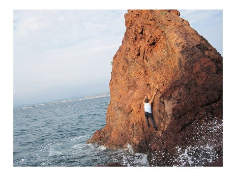 Deep Water Solo on a small rock at Point de l'Aiguille