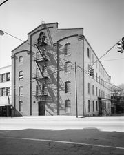 GENERAL VIEW, MAIN ST. FACADE AT LEFT, THIRTEENTH ST. SIDE AT RIGHT - Bowman and Moore Leaf Tobacco Factory, Main and Thirteenth