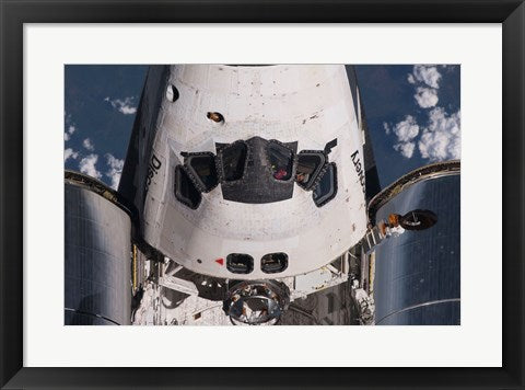 Partial view of the crew cabin and forward payload bay of the space shuttle Discovery